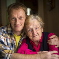 Senior Alzheimer's care patient with her son. Dementia care, memory care, Pavilion at the Masonic Homes