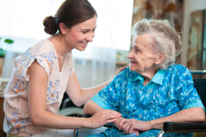 Nurse with senior resident at Assisted Living community, from the Pavilion at the Masonic Homes in California